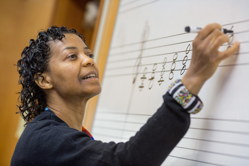 A woman teaching music